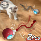 Cat playing with a HOZER cat toy on a wooden floor
